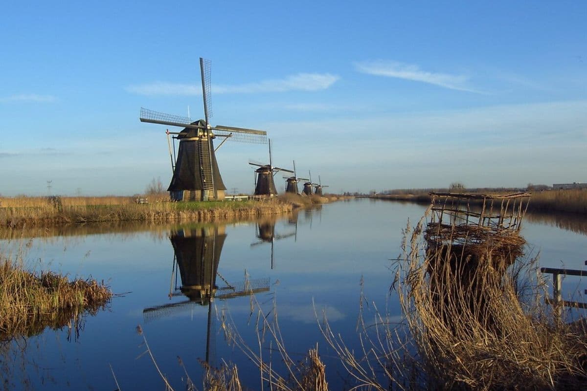 The windmills of Kinderdijk beside a canal