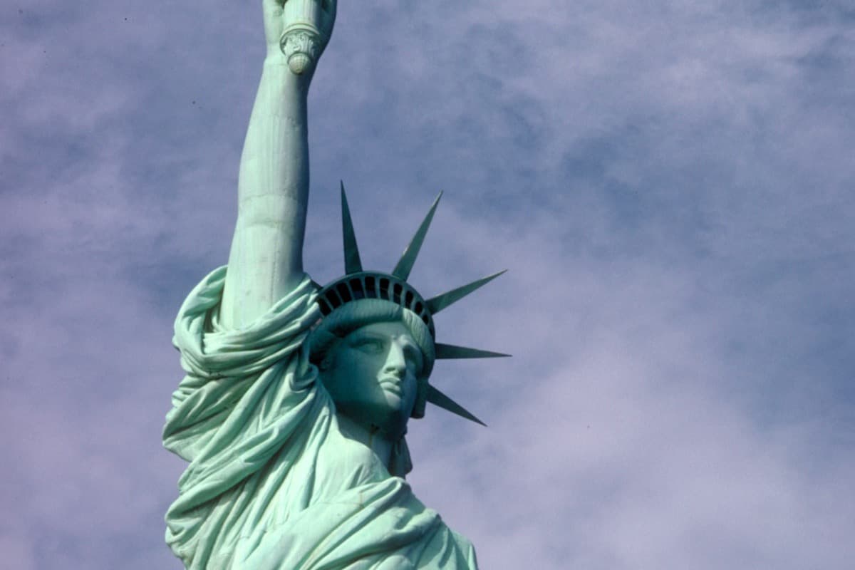 The Statue of Liberty against a cloudy sky